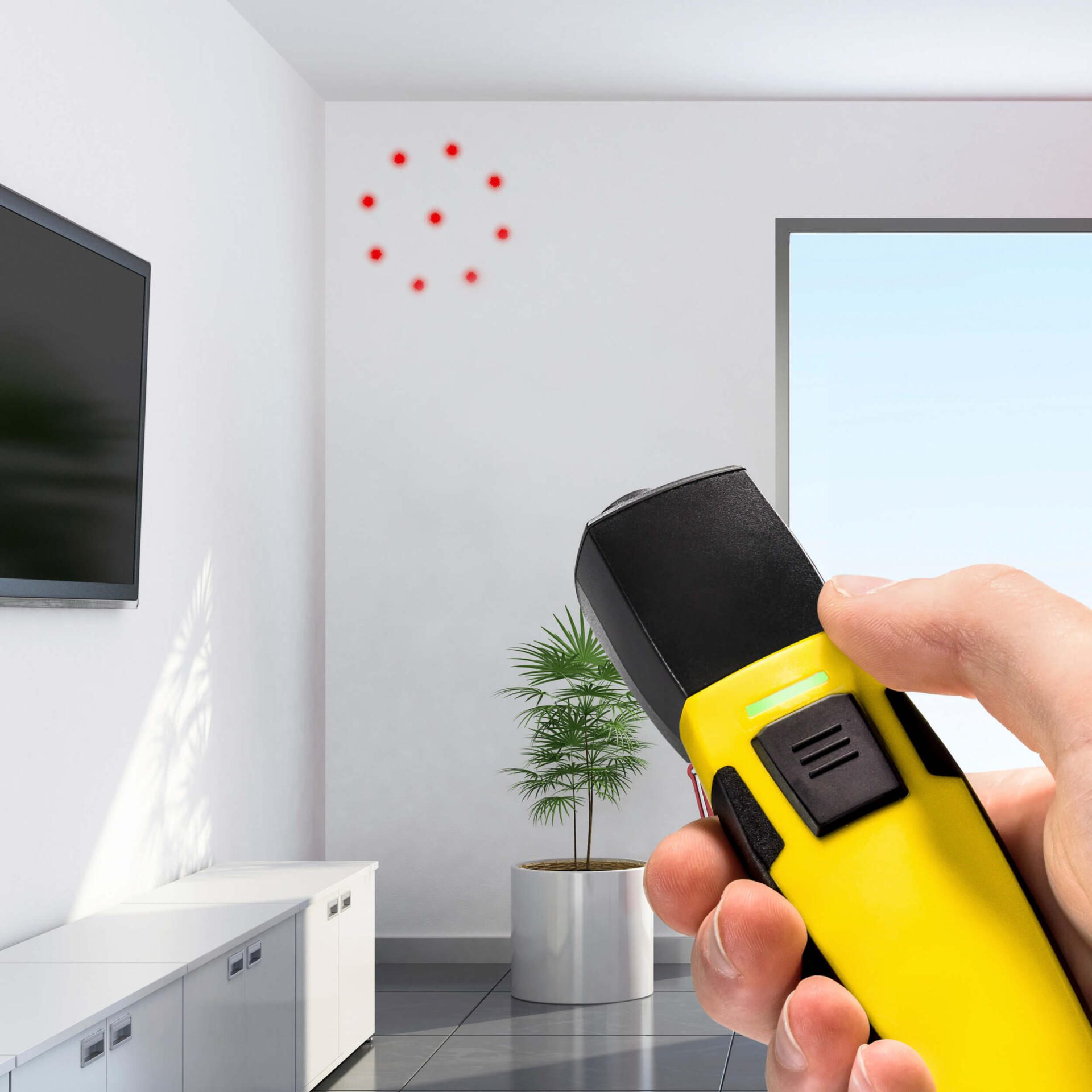 BP21WP App-Sensor Pyrometer: Hand bedient Thermometer, rote Messpunkte an Wand. Smartphone-Bedienung für präzise Temperaturmessung.